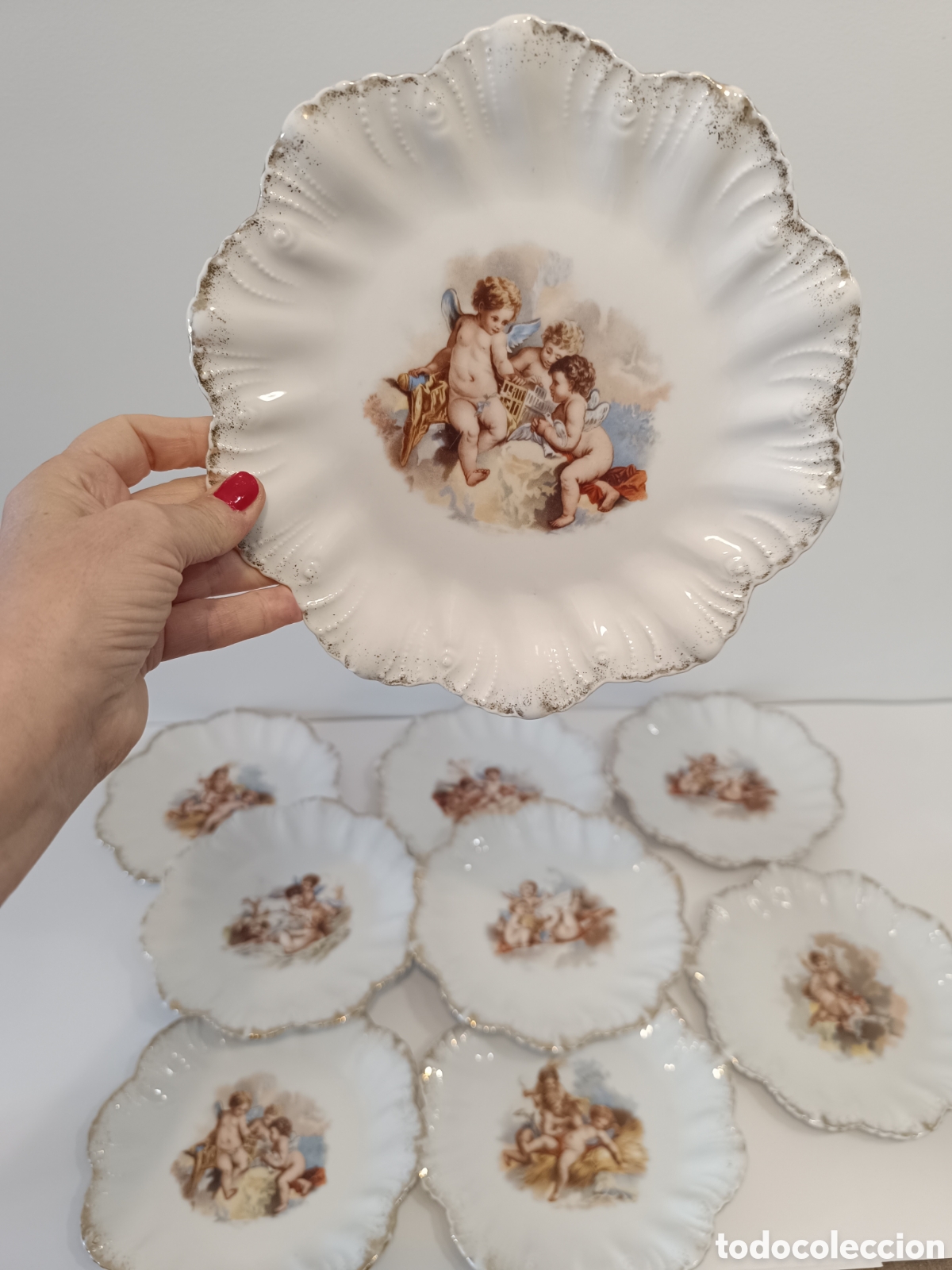 Antig&uuml;edades: 9 Platos porcelana angelotes 1900