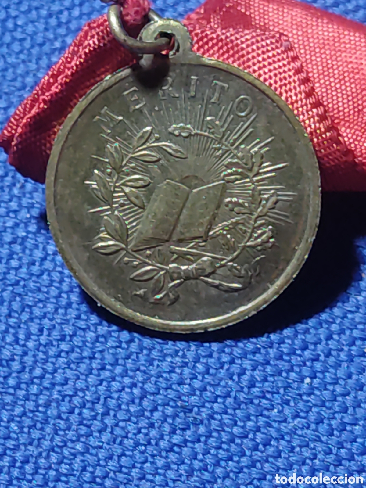 Antig&uuml;edades: Medalla premio a la aplicaci&oacute;n.