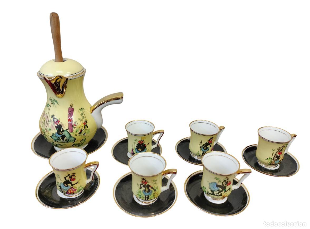 Antiquit&auml;ten: CONJUNTO DE CHOCOLATERA, TAZAS Y PLATOS DE CER&Aacute;MICA. CARICATURA COON. ESPA&Ntilde;A. CIRCA 1940-1950.