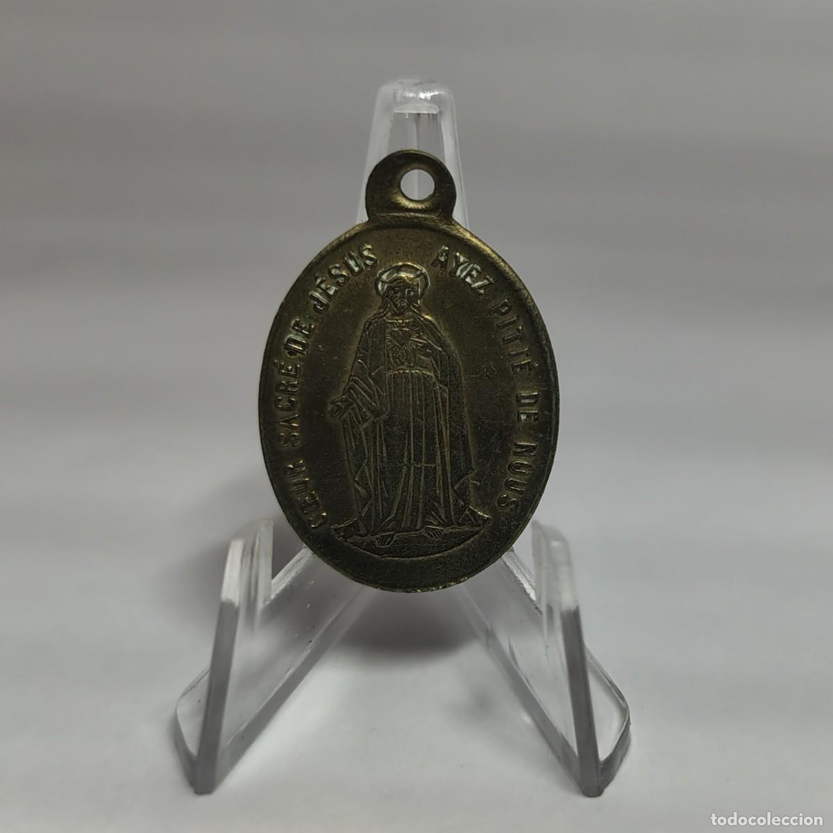 Antig&uuml;edades: Medalla religiosa / Colgante: Sagrado Coraz&oacute;n de Jes&uacute;s, ten piedad de nosotros (Franc&eacute;s). M360
