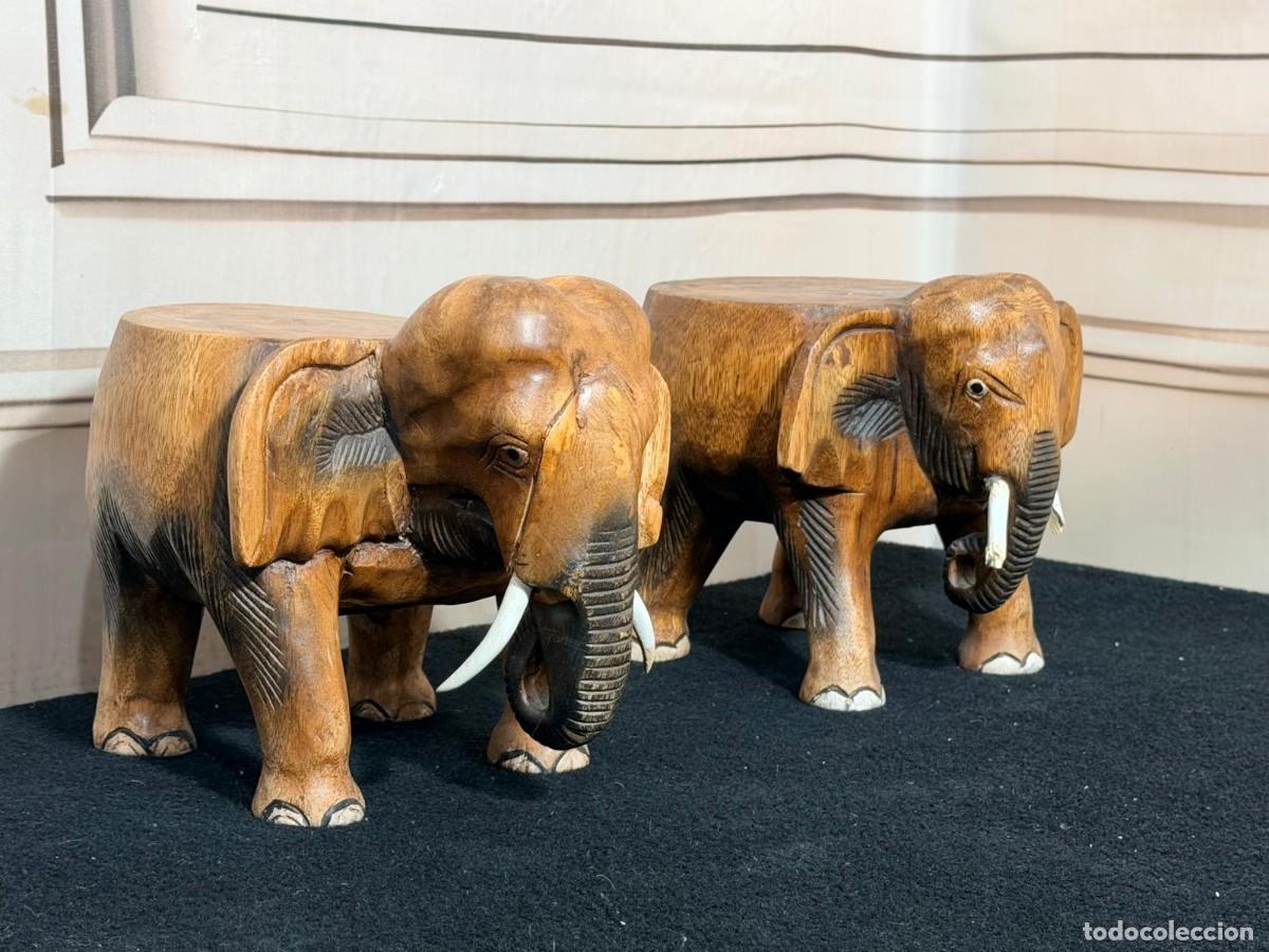 Antig&uuml;edades: Pareja de taburetes o mesas auxiliares de madera tallados a mano con forma de elefante