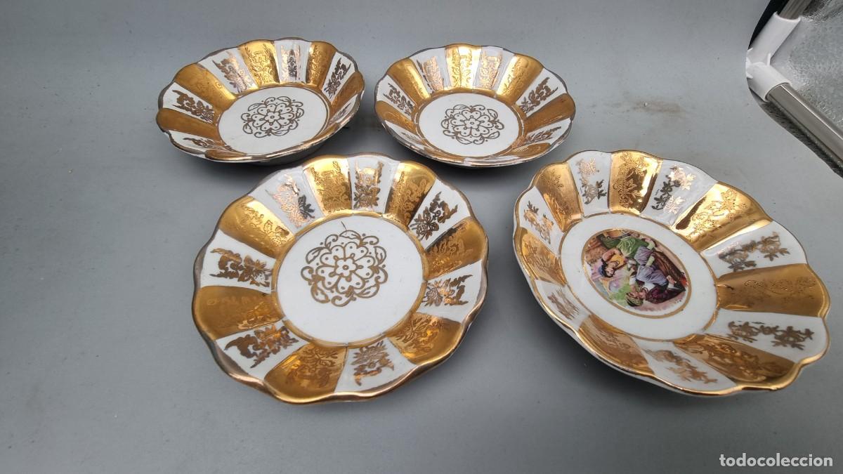 Antig&uuml;edades: 4 platos de porcelana decorados con oro