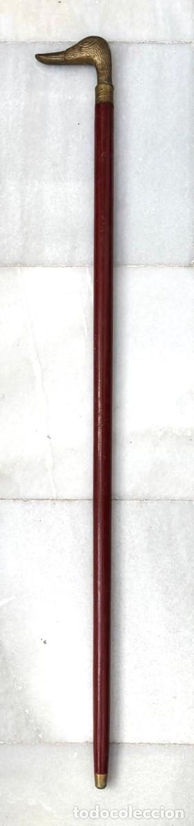 Antig&uuml;edades: BASTON DE MADERA CON EMPU&Ntilde;ADURA DE METAL EN FORMA DE PATO, TERMINACION EN PINCHO. BASTON-21