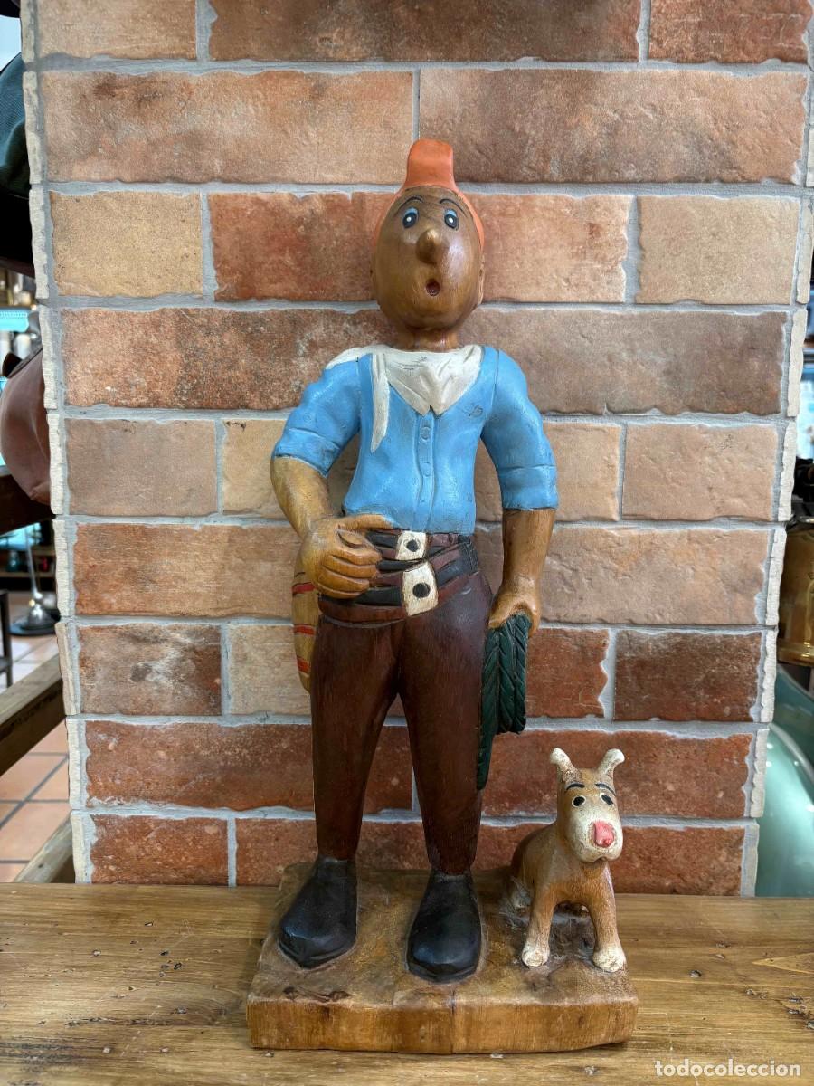Antig&uuml;edades: Escultura vintage de Tint&iacute;n vaquero tallada en madera con Mil&uacute;