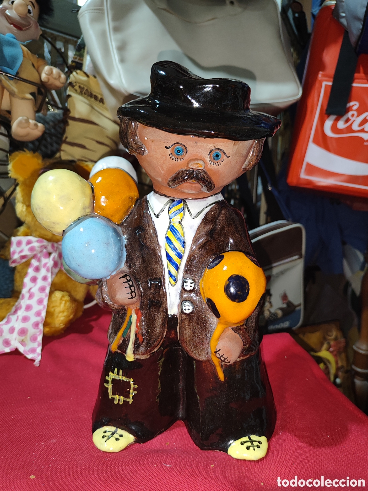 Antig&uuml;edades: Original figura de barro Vendedor de globo sello TAG