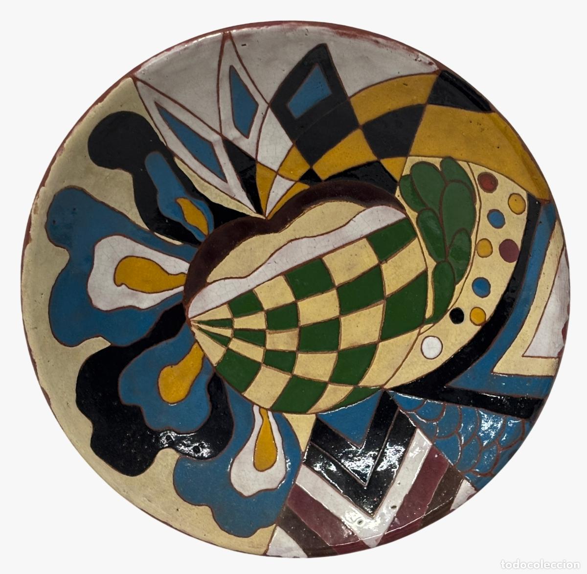 Antiques: Rosa Yag&uuml;e, plato de cer&aacute;mica esmaltada, Sao Paulo. 27,5 cm de di&aacute;metro.