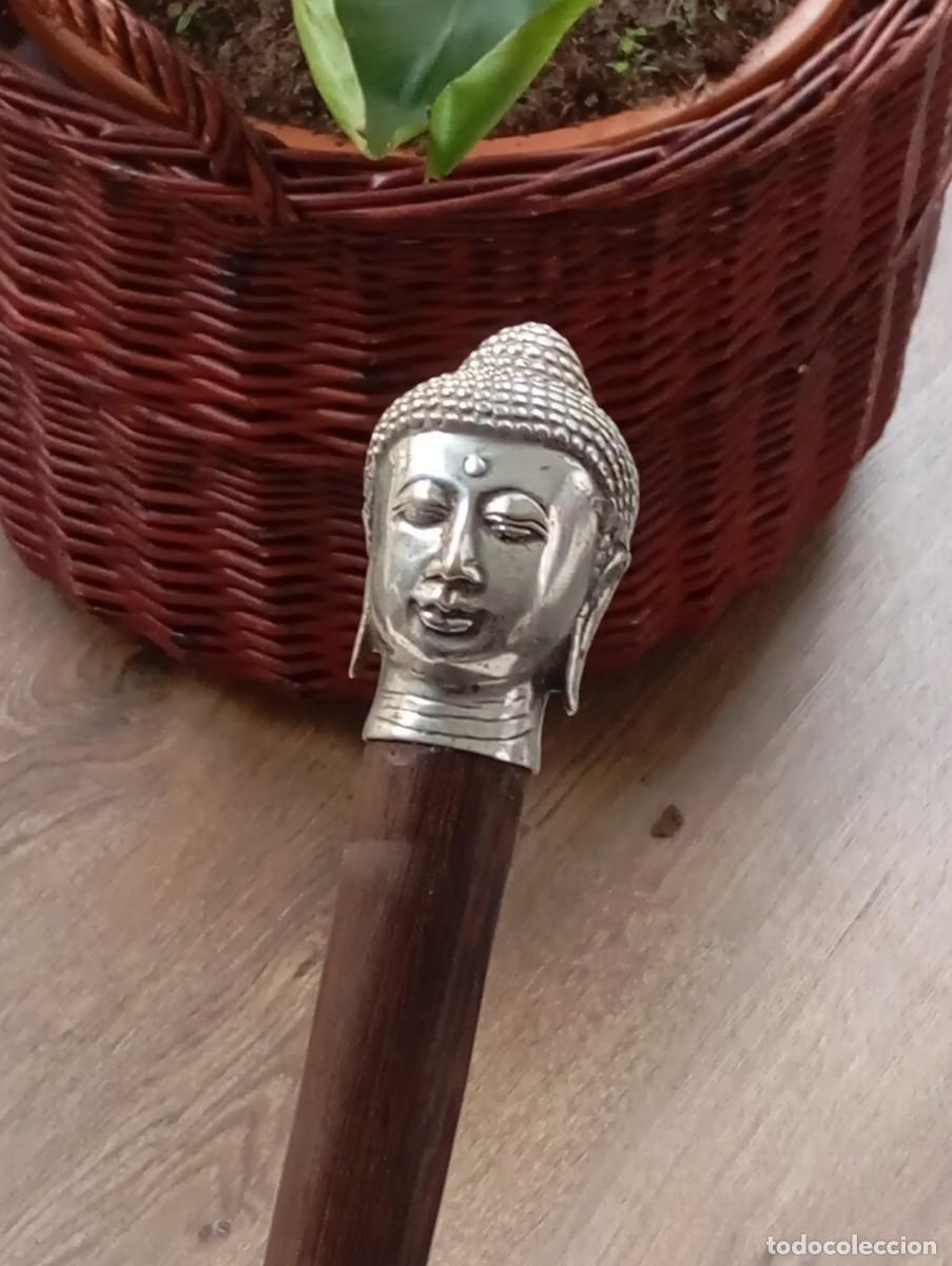 Antig&uuml;edades: Original bast&oacute;n con cabeza de Buda en metal.