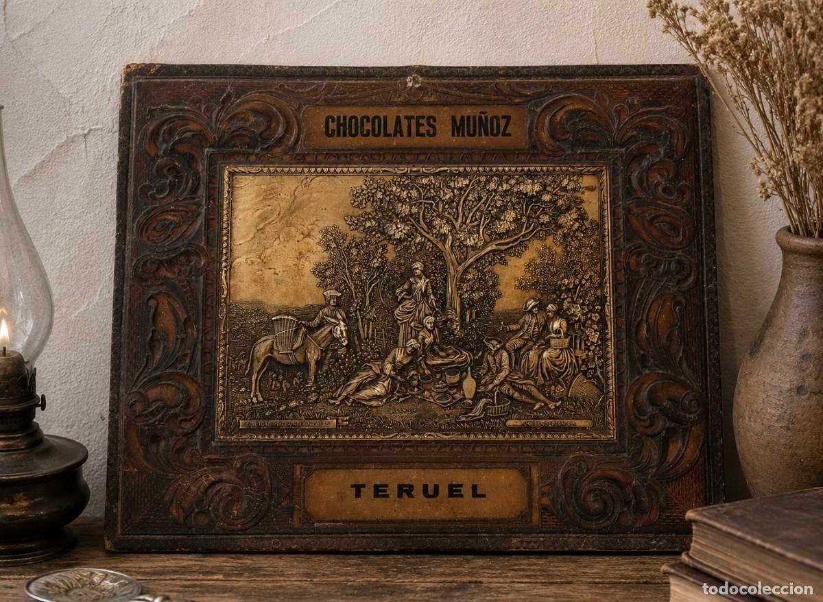 Antig&uuml;edades: Panel publicitario Chocolates Mu&ntilde;oz piel y metal