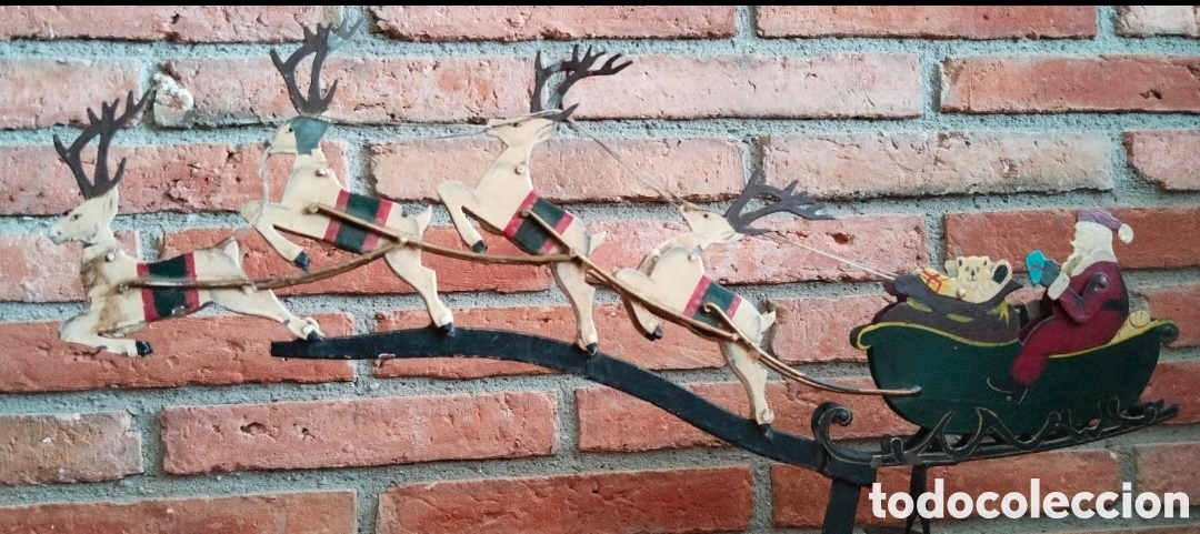 Antig&uuml;edades: Balanc&iacute;n cin&eacute;tico - Pap&aacute; Noel y renos (de metal)