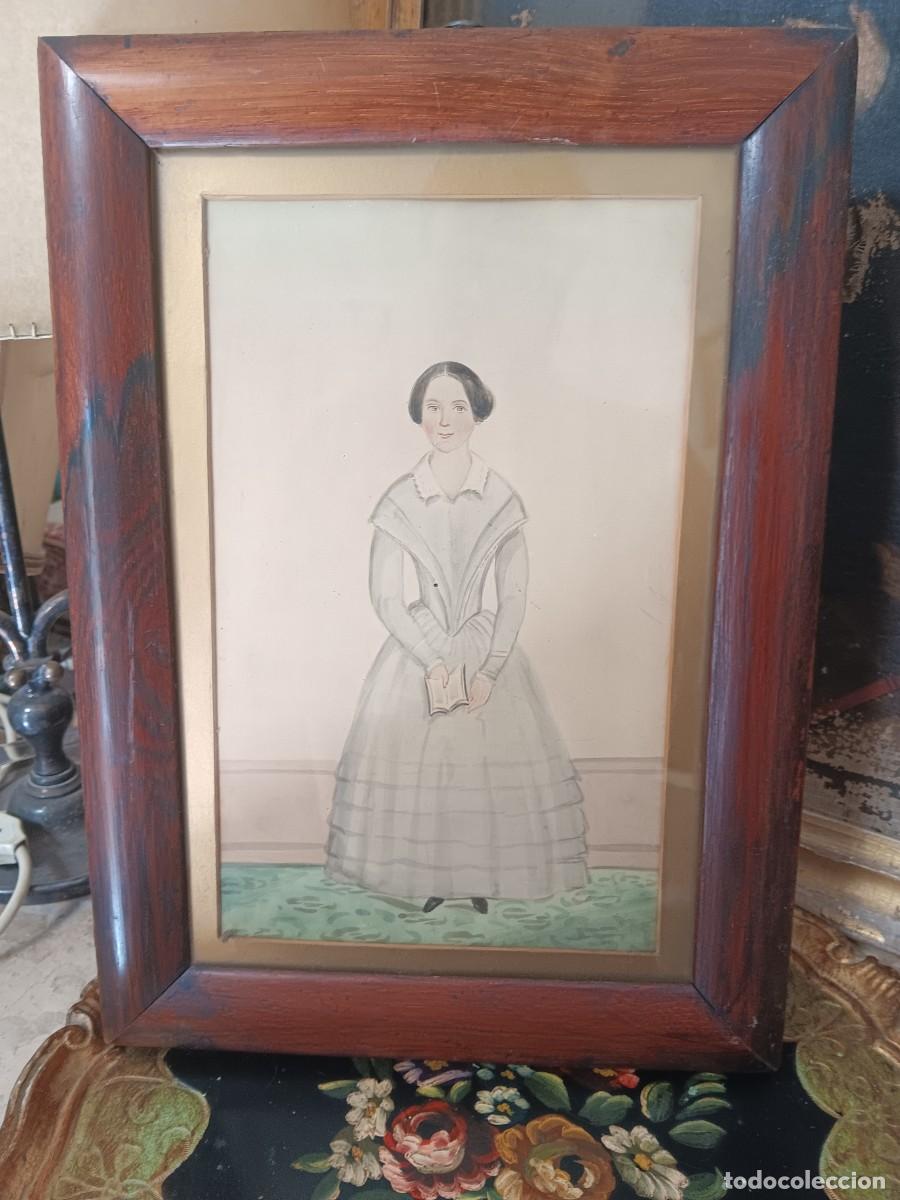 Antig&uuml;edades: retrato antiguo de una mujer enmarcado en madera.Este tipo de obras son retratos a tinta y acuarela