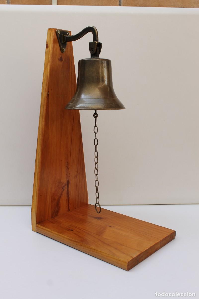 Antig&uuml;edades: CAMPANA DE BROCE, LLAMADOR CON SOPORTE.
