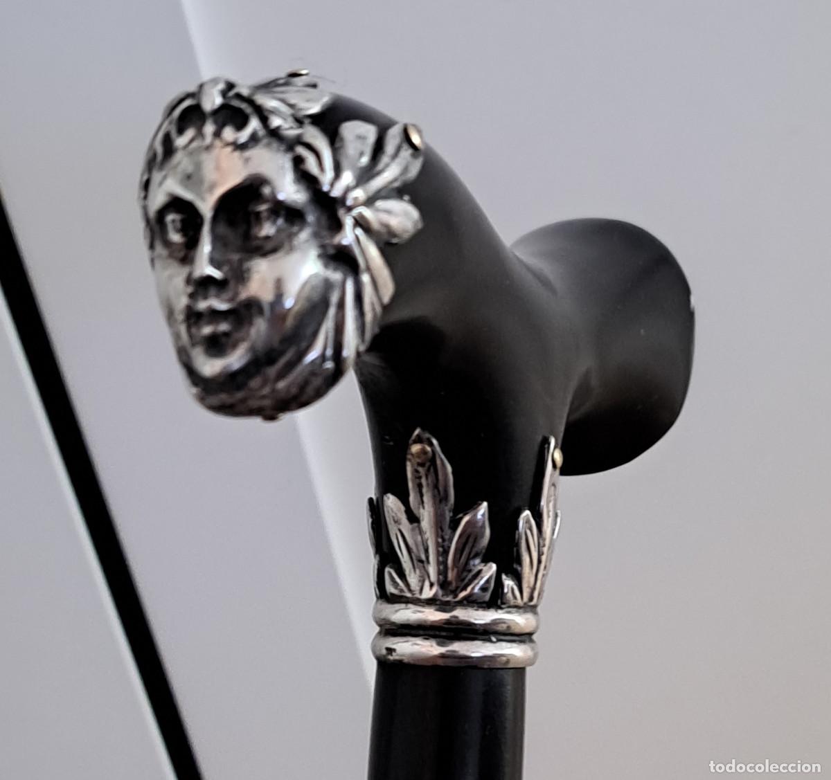 Antig&uuml;edades: BASTON DE PASEO - FINNA - EMPU&Ntilde;ADURA CON RELIEVES DE DEIDAD EN PLATA DE LEY - 94 CMS.