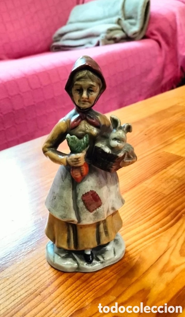 Antig&uuml;edades: Figurita de porcelana de Campesina