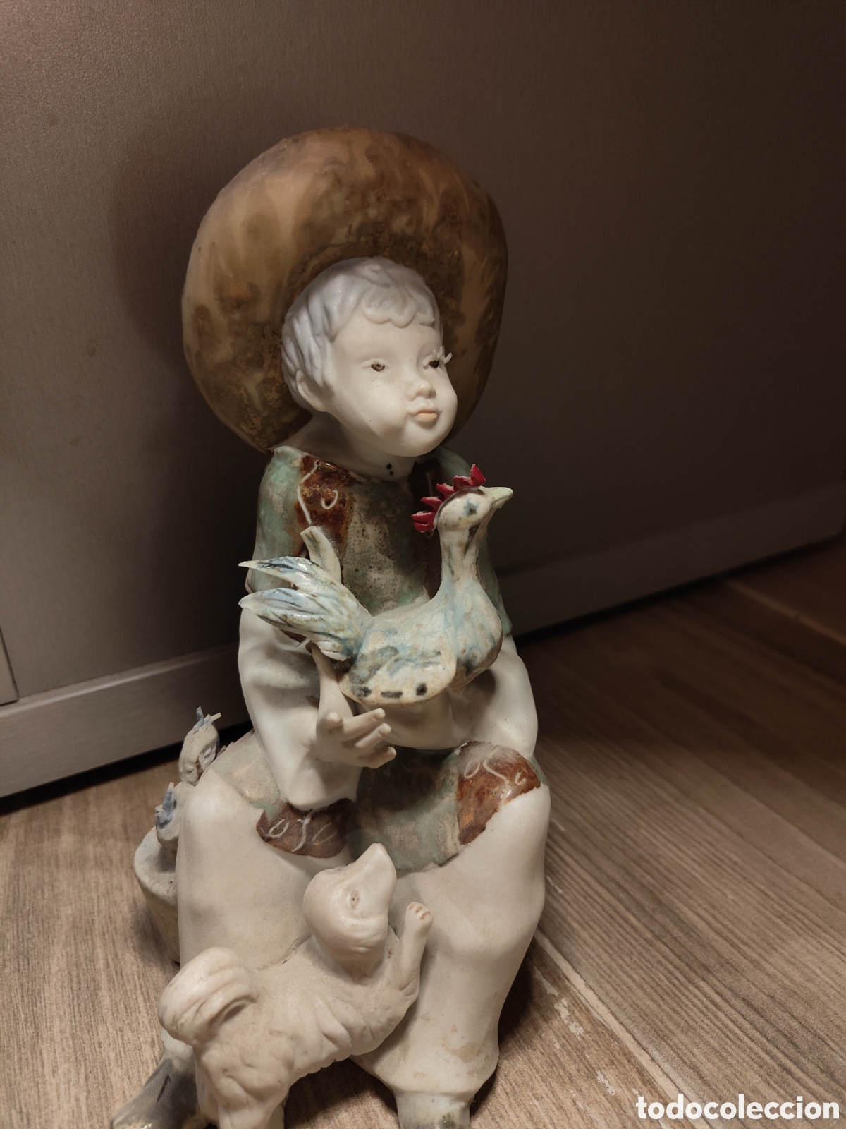 Antig&uuml;edades: Figura de porcelana ni&ntilde;o con animales