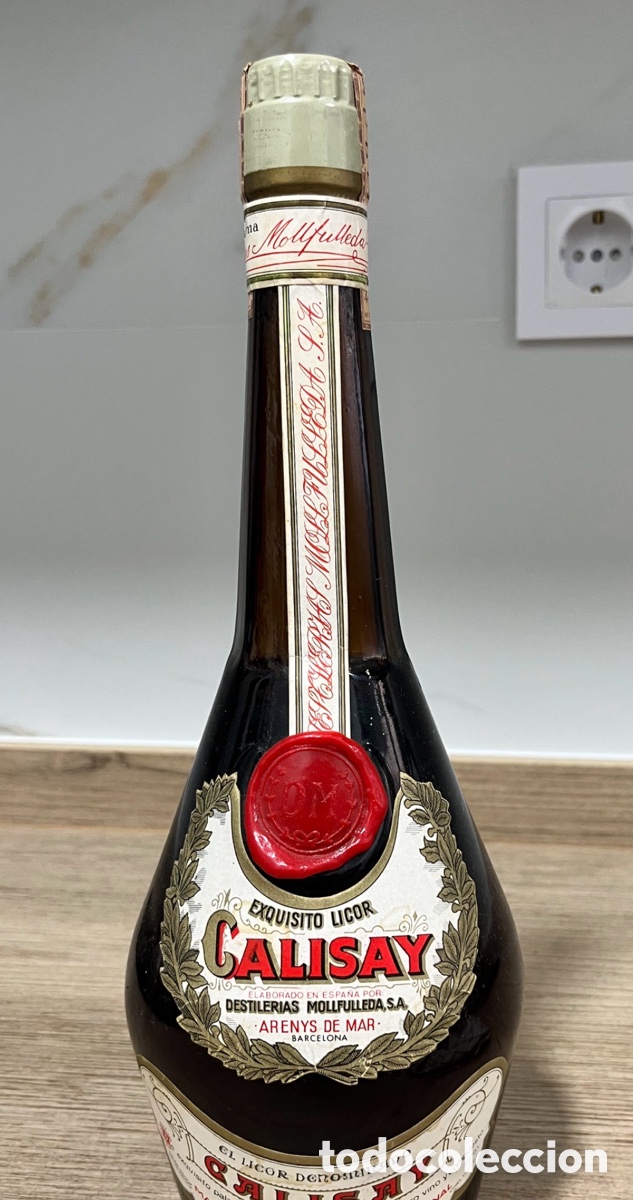 Antig&uuml;edades: Antigua botella CALISAY Mollfulleda Arenys de Mar &ndash; Precinto 4 Pesetas &ndash; Sin abrir