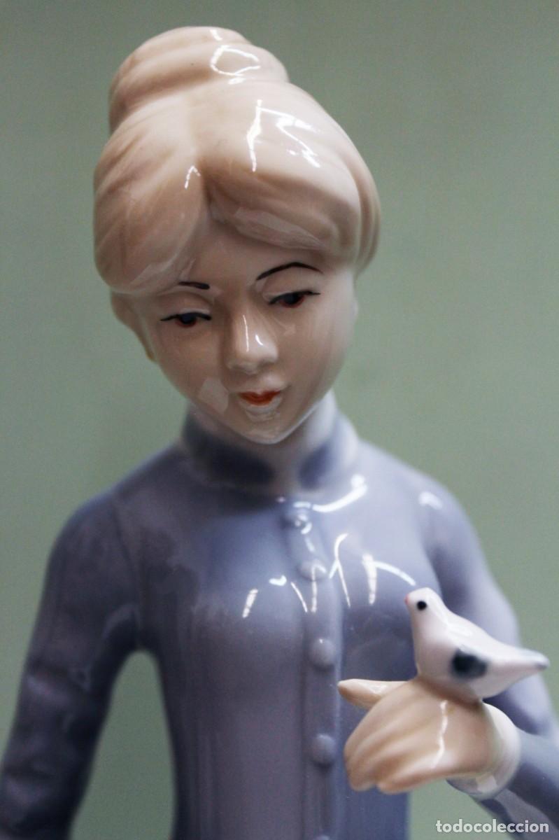 Antig&uuml;edades: Casades Spain vintage porcelain figurine of a woman holding a bird