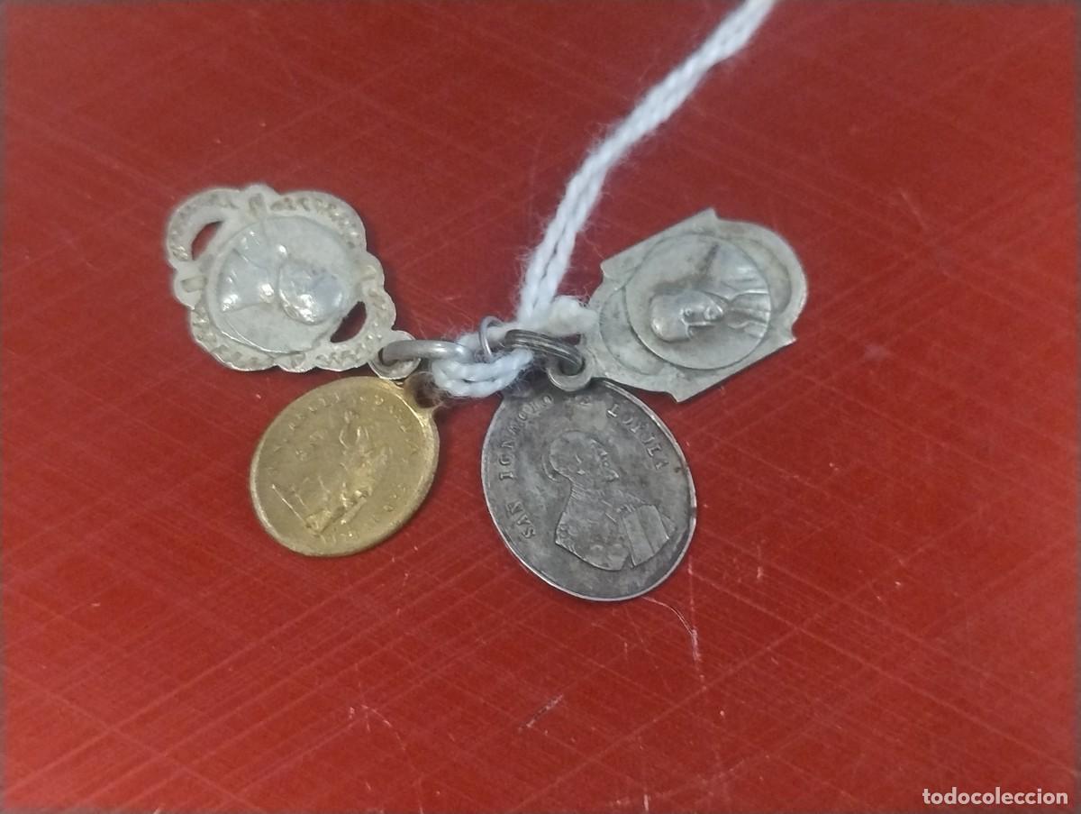 Antig&uuml;edades: Lote de 4 medallitas de San Ignacio de Loyola. Sobre 1,50 cm