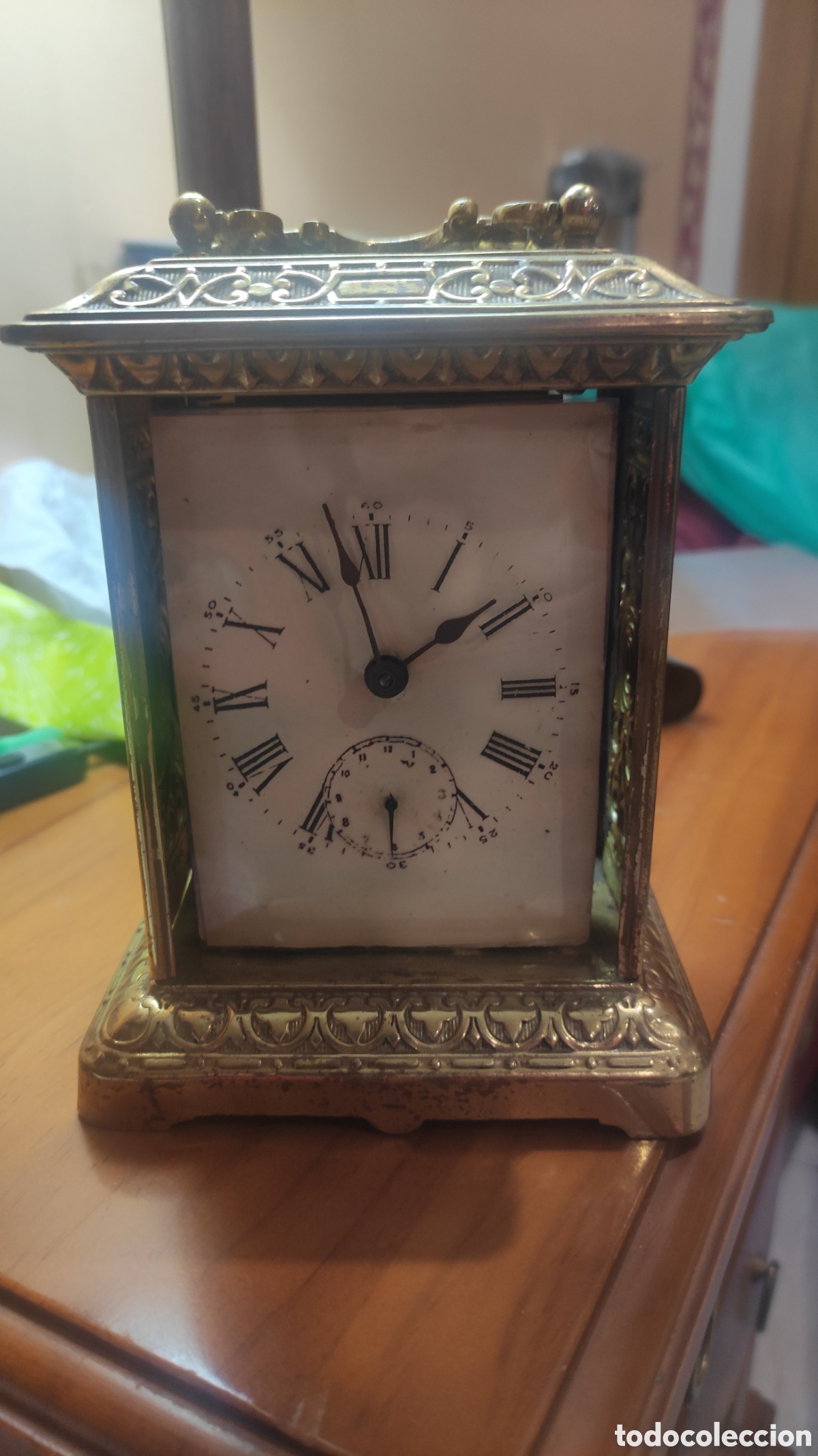Antig&uuml;edades: Reloj de carruaje ansonia clock . En dorado . Precioso