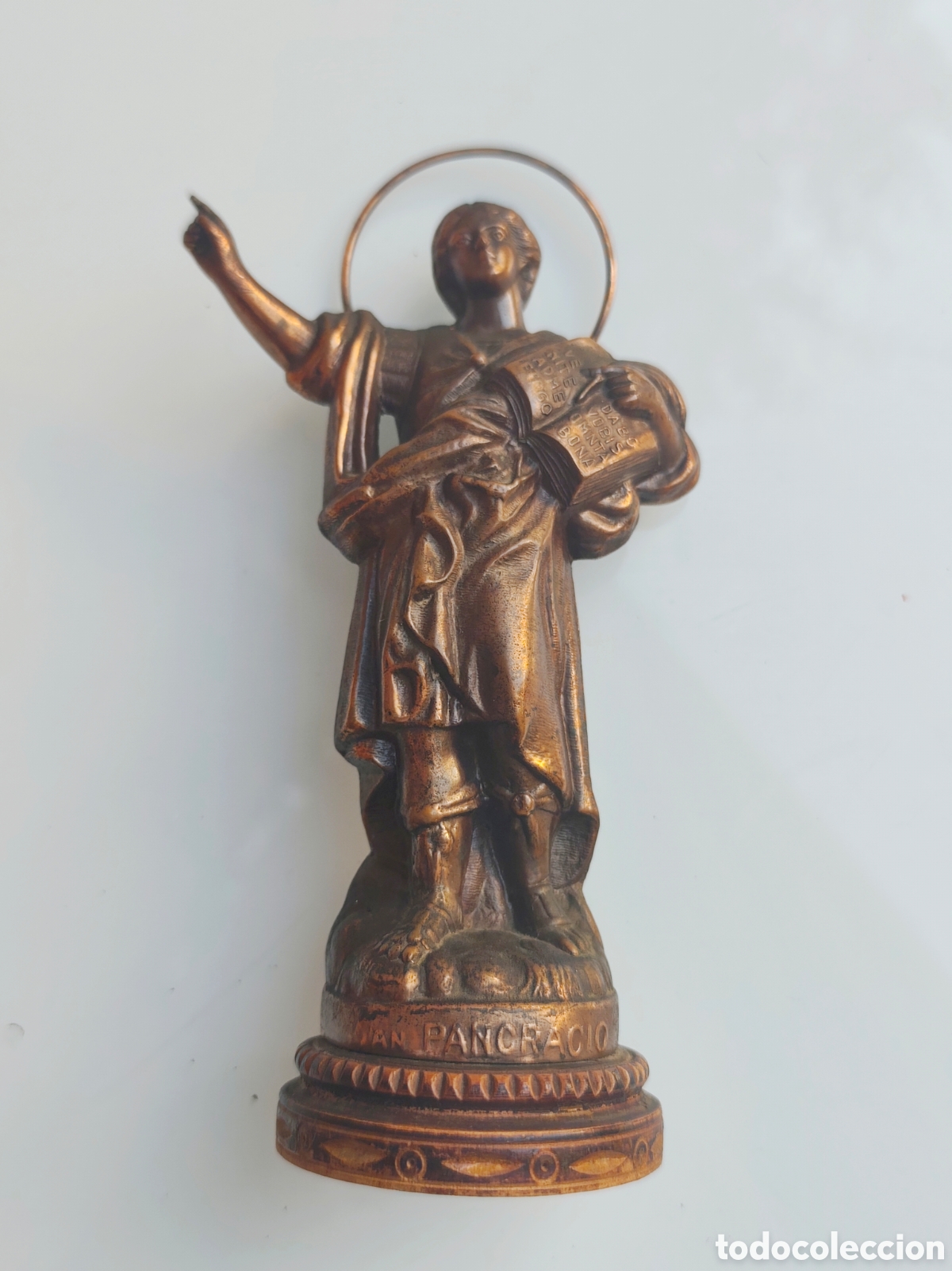 Antig&uuml;edades: San Pancracio. Cobre sobre peana madera. 19 cm. 375 gr
