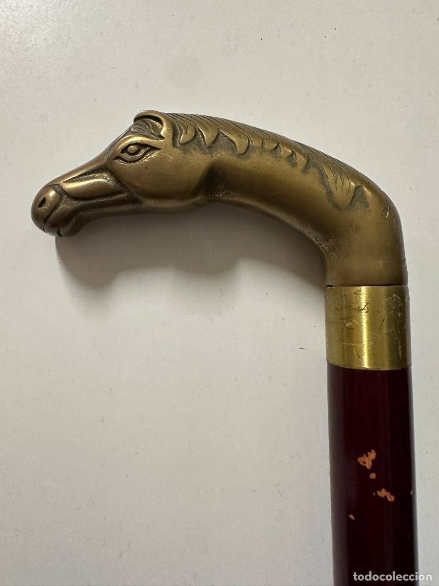 Antig&uuml;edades: Bast&oacute;n con el mango de bronce C1