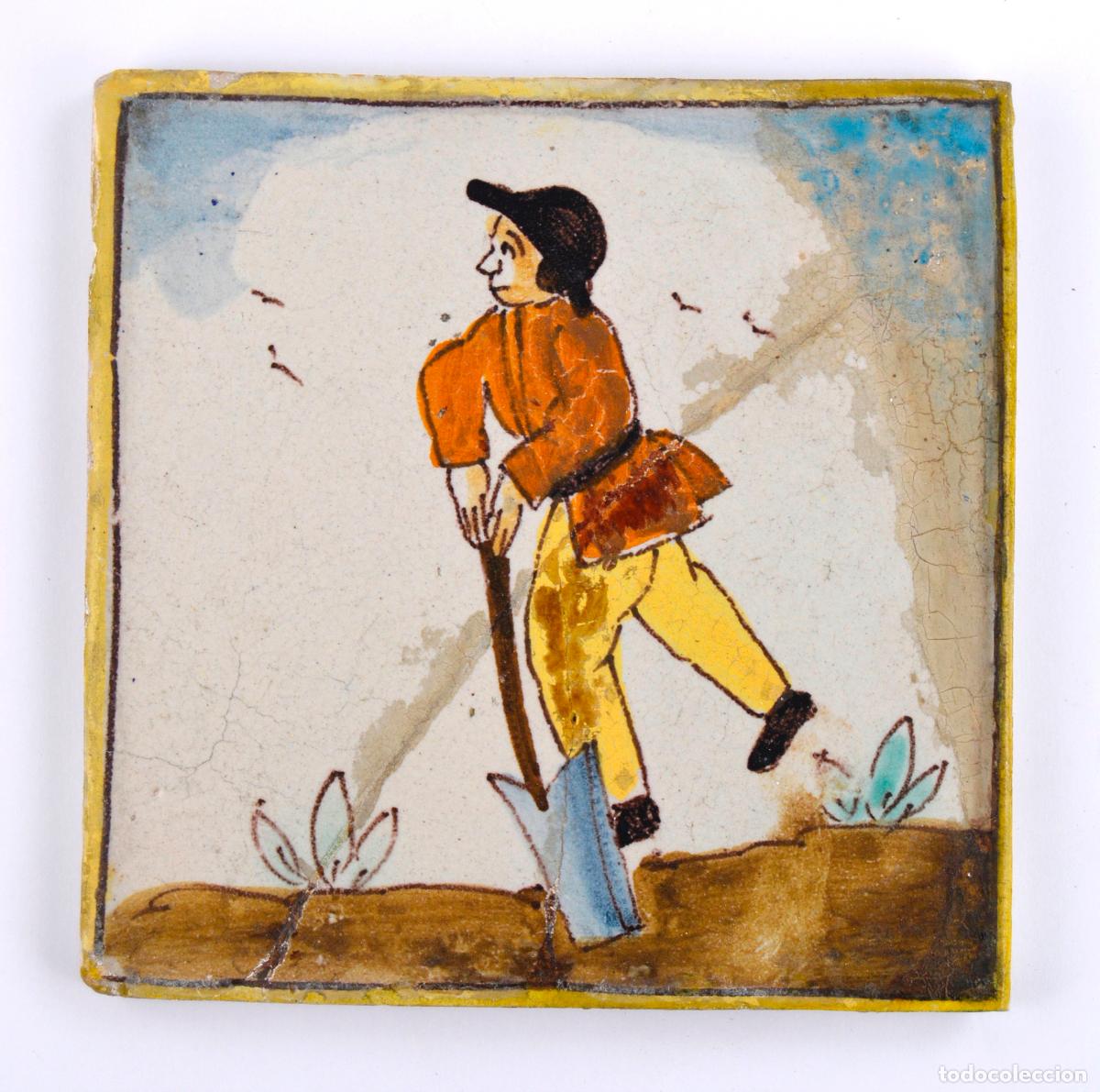 Antig&uuml;edades: Agricultor, azulejo de cer&aacute;mica catalana, serie Arts i Oficis, finales siglo XVIII.