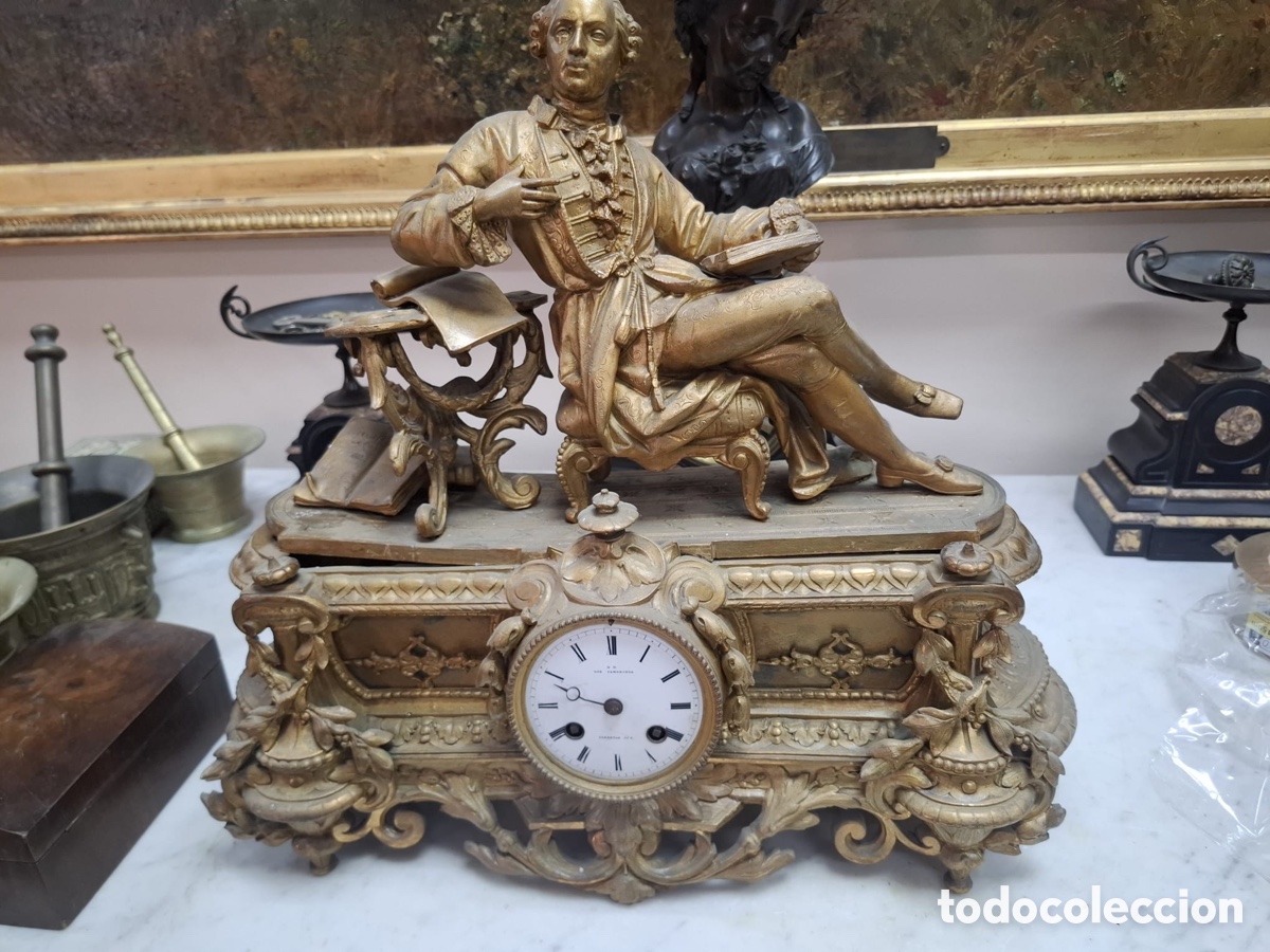 Antig&uuml;edades: Reloj en calamina dorada