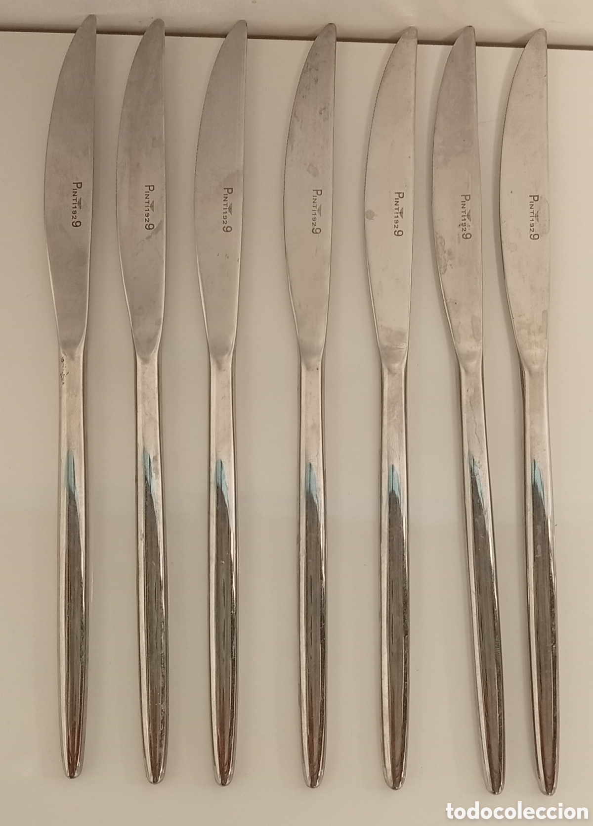 Antig&uuml;edades: .SET DE 7 CUCHILLOS PINTI 1929
