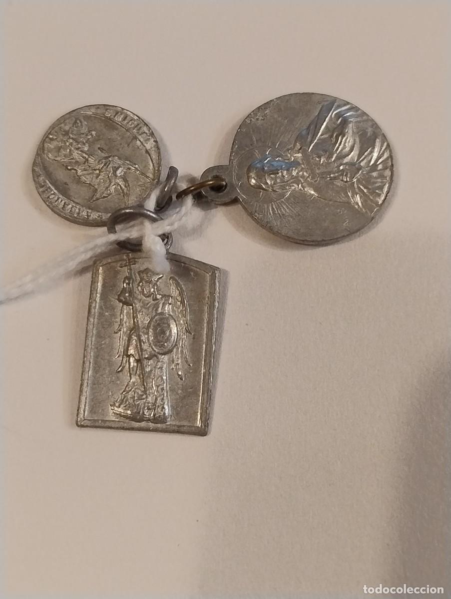 Antig&uuml;edades: Lote de 3 medallas de San Miguel. La mas grande 2 x 1,50 cm