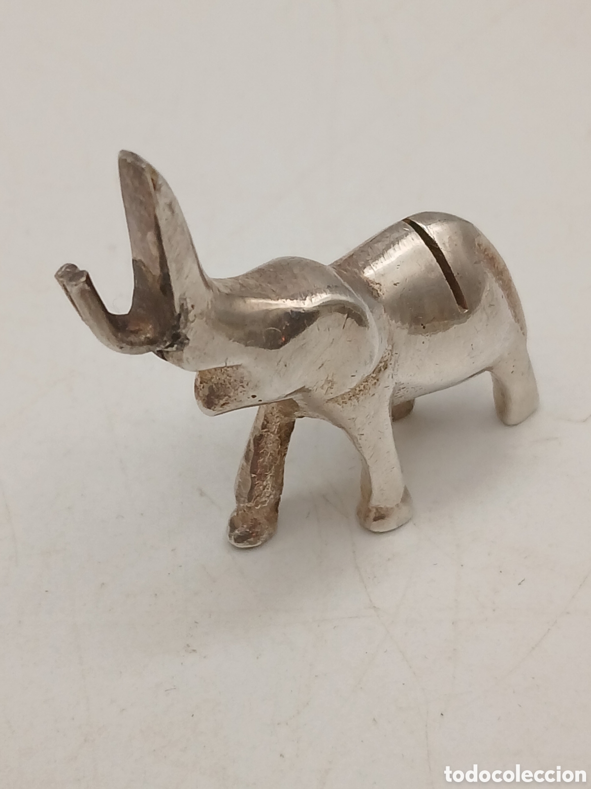 Antig&uuml;edades: Peque&ntilde;a escultura metal plateado. Soporte etiquetas. Elefante