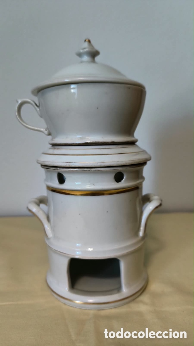 Antig&uuml;edades: Elegante calentador de taza de porcelana esmaltada siglo XX