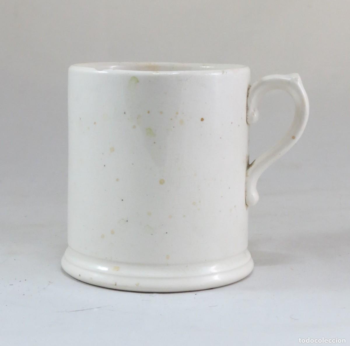 Antig&uuml;edades: Caneca em faian&ccedil;a branca; N&atilde;o marcada; Altura-11cm; Di&acirc;metro-9.5cm