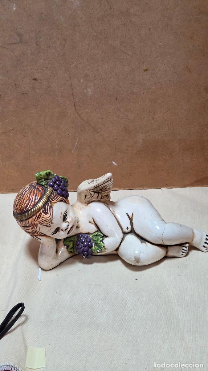 Antig&uuml;edades: figura de angel acostado