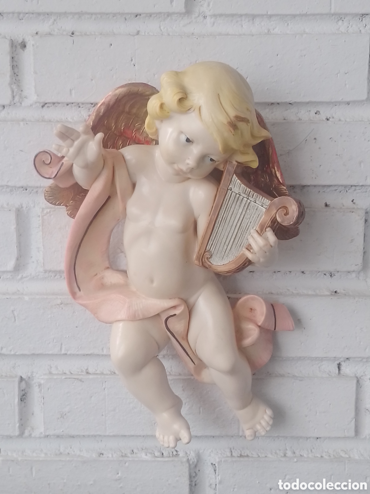 Antig&uuml;edades: Escultura Querub&iacute;n tocando Arpa.
