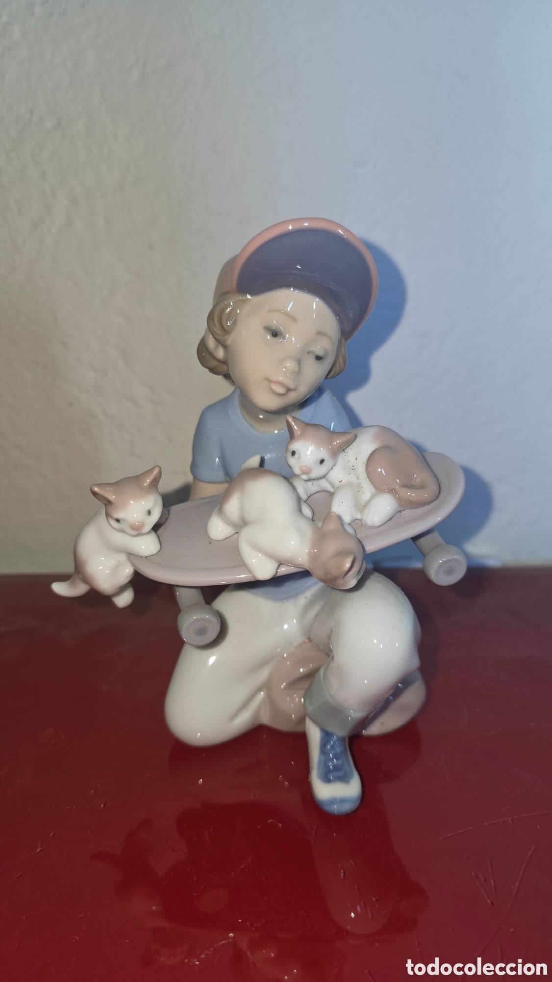 Antig&uuml;edades: Figura porcelana lladro patinete con gatitos