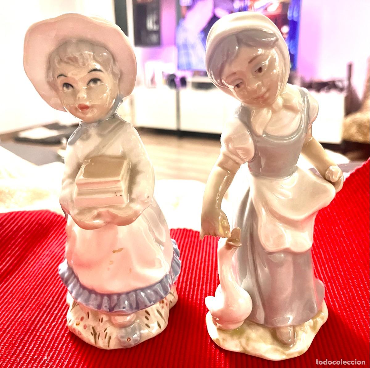 Antig&uuml;edades: Pareja de mu&ntilde;ecas de porcelana con marca de la casa