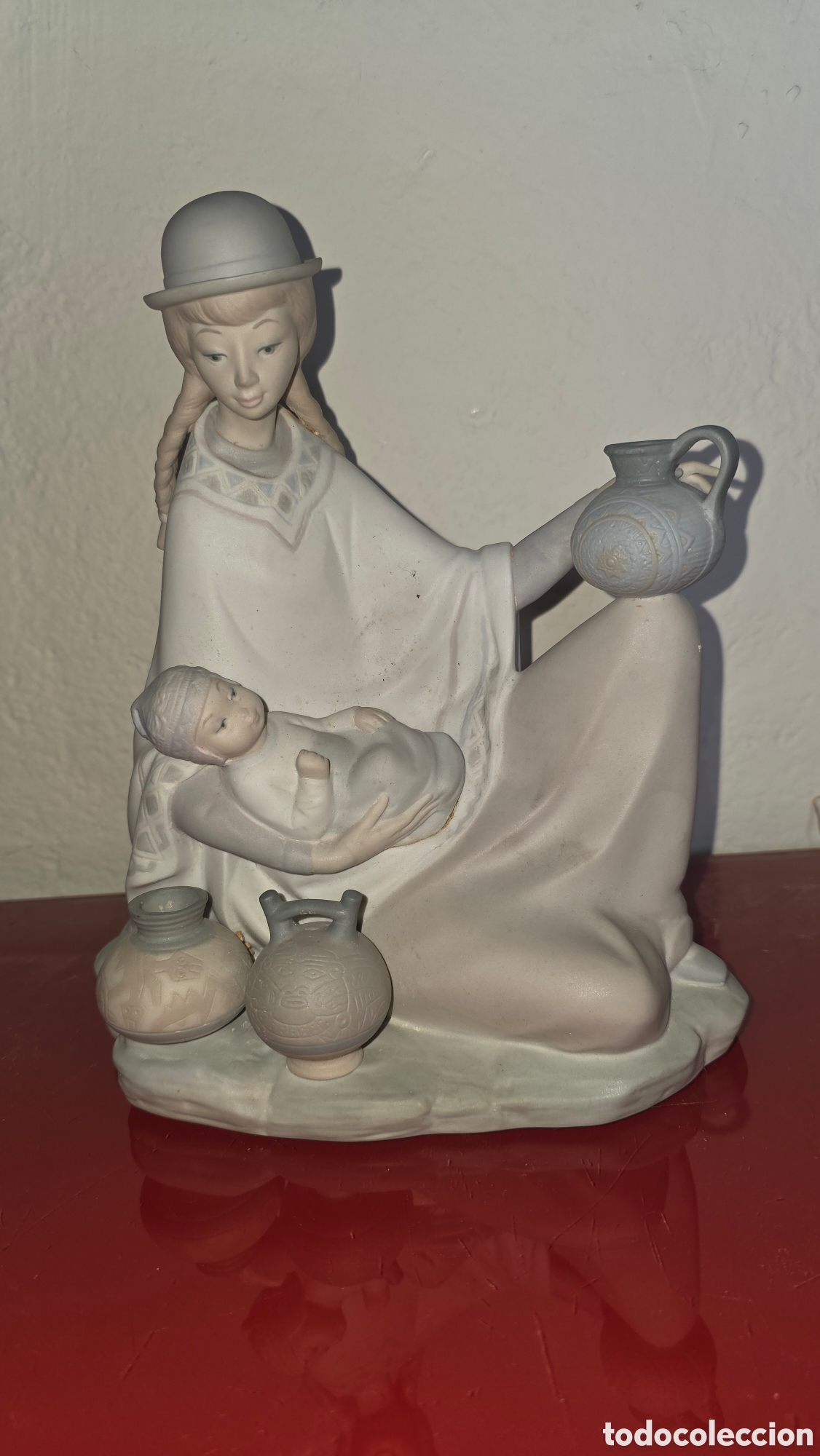 Antig&uuml;edades: Figura porcelana lladro joven peruana con bebe