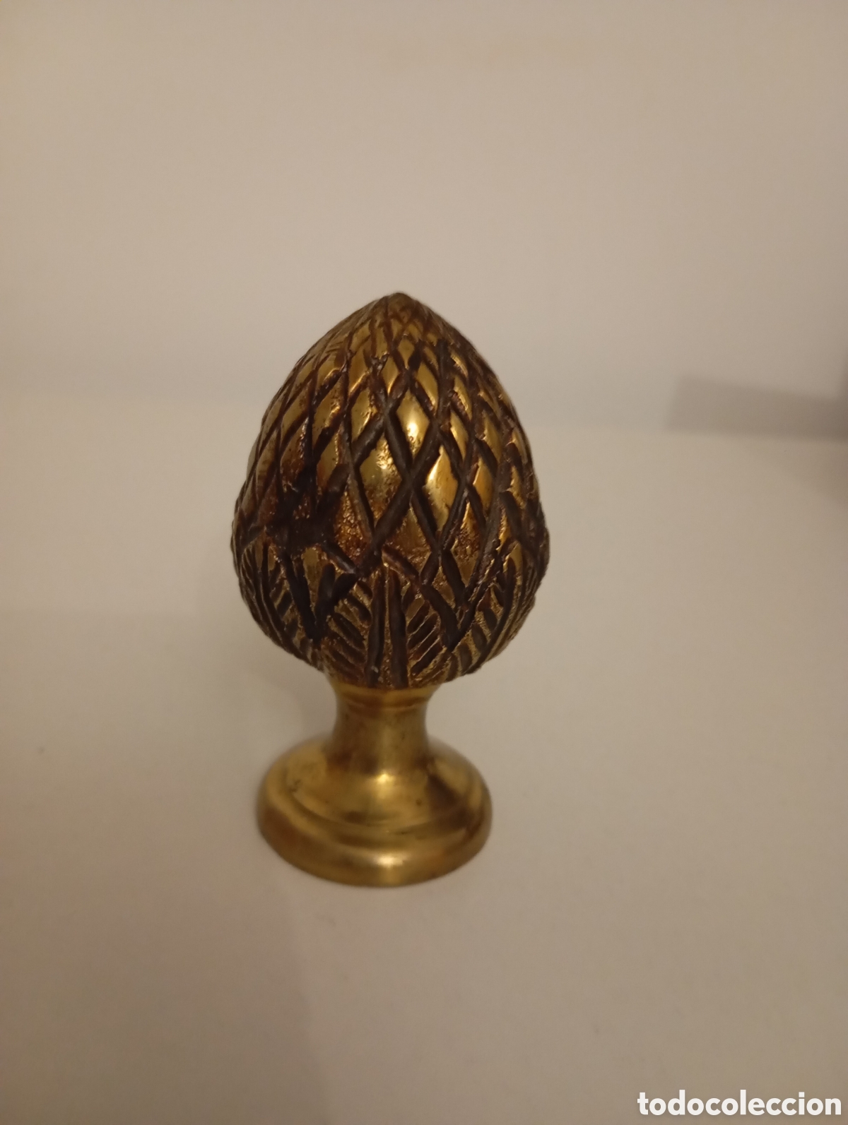 Antiguidades: Figura en bronce/lat&oacute;n en forma de pula