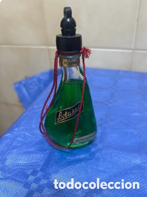 Antig&uuml;edades: Botella licor mini cerrada y con el l&iacute;quido - Foto 1