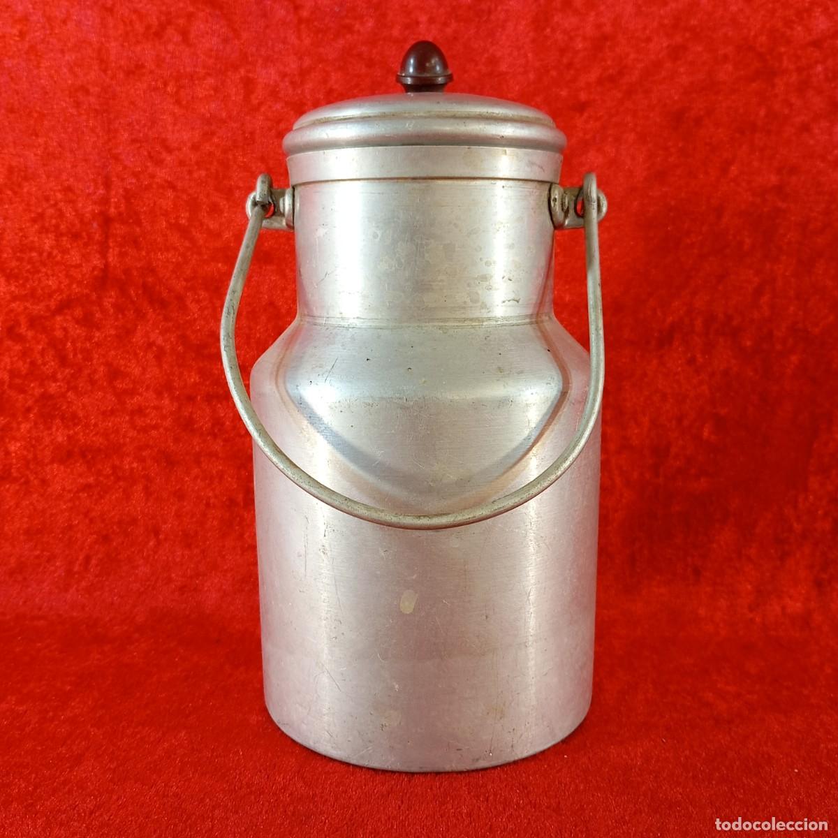Antig&uuml;edades: ANTIGUO C&Aacute;NTARO DE LECHE DE ALUMINIO - MEDIADOS DEL SIGLO XX - FABRICADO EN SUIZA - 1L - 11 X 21 CM