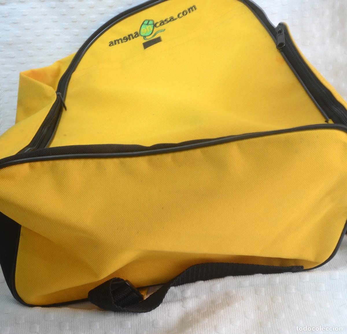 Antig&uuml;edades: Mochila amarilla logotipo de amenaencasa.com