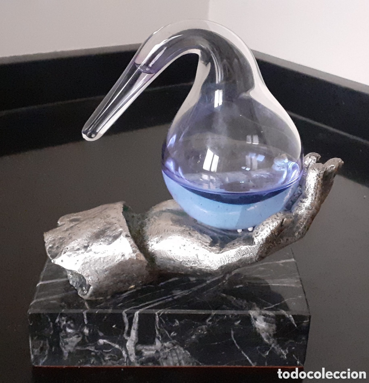 Antig&uuml;edades: Escultura metal, piedra y cristal mano con matraz