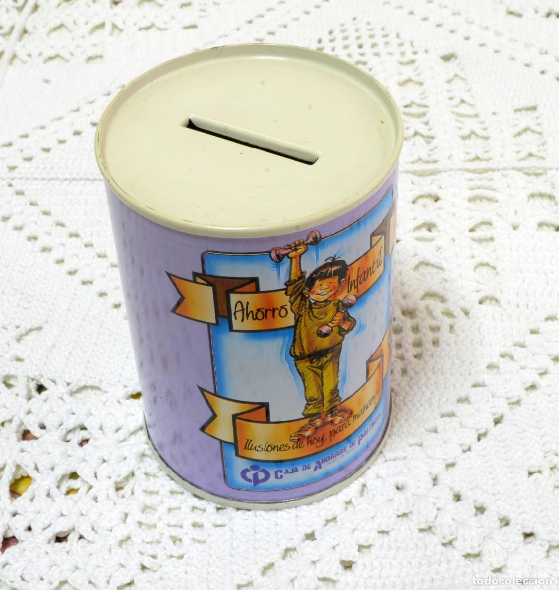 Antig&uuml;edades: Hucha cil&iacute;ndrica de metal, antigua Caja de Ahorros de Palencia, con ilustraci&oacute;n infantil