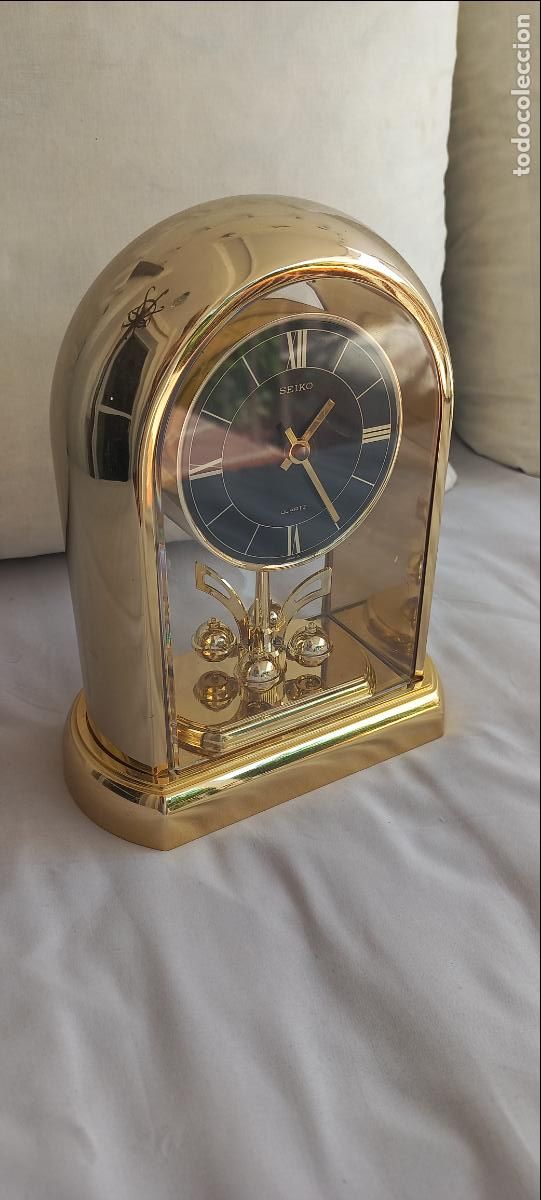 Arte: Reloj de sobremesa Seiko con p&eacute;ndulo giratorio, ed. aniversario. De cuarzo. No Funciona. Ref.QQZ189G