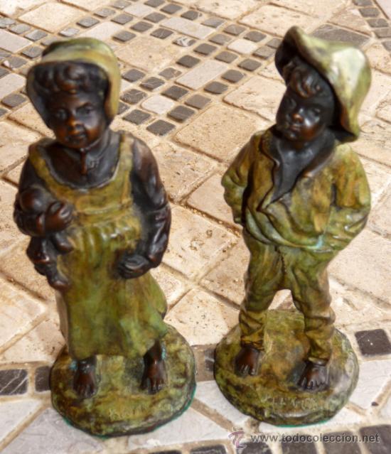 Arte: Simp&aacute;ticas figuras en bronce, firma KLEY