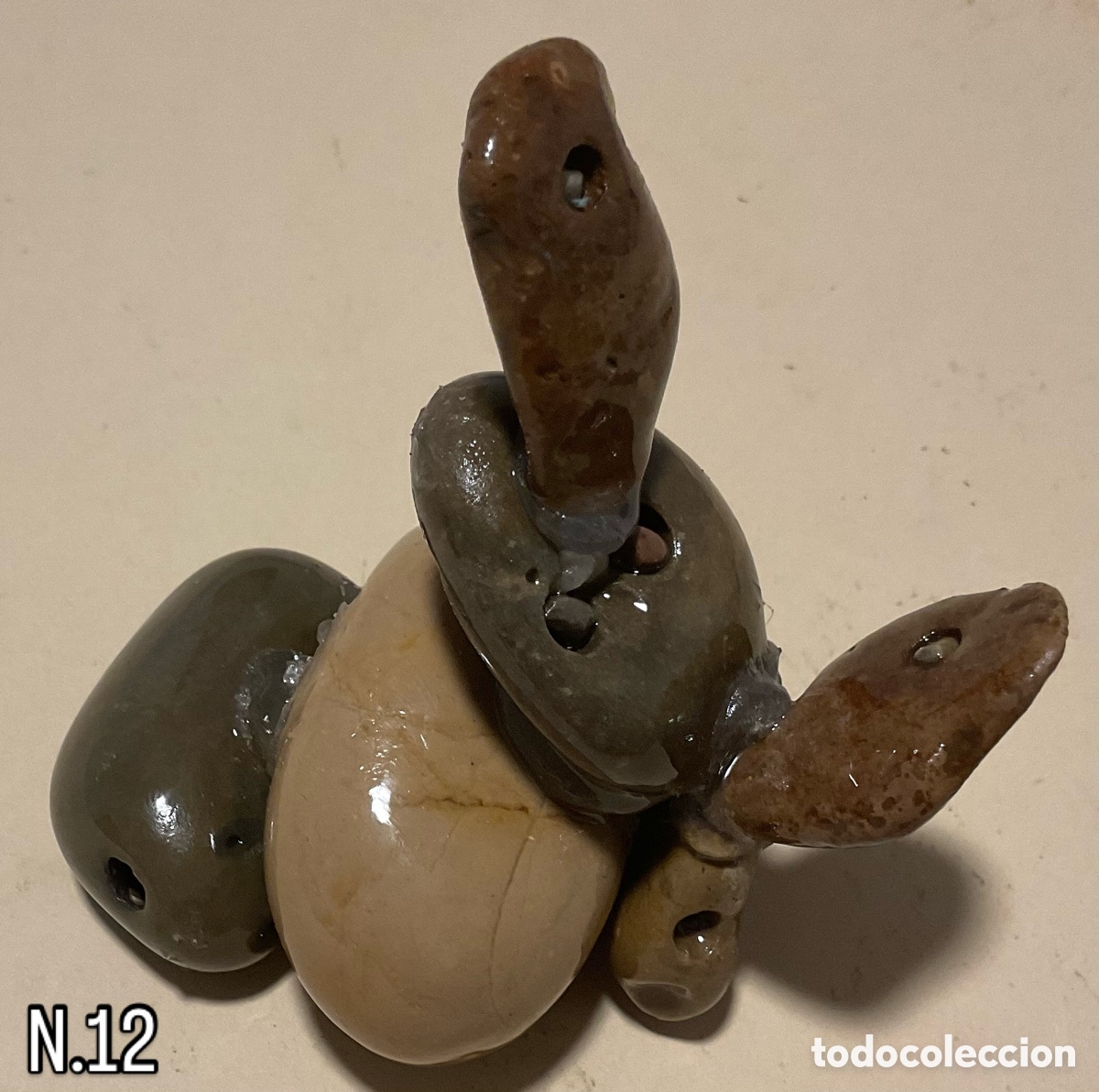 Art: N&uacute;mero 12. Escultura de piedra.