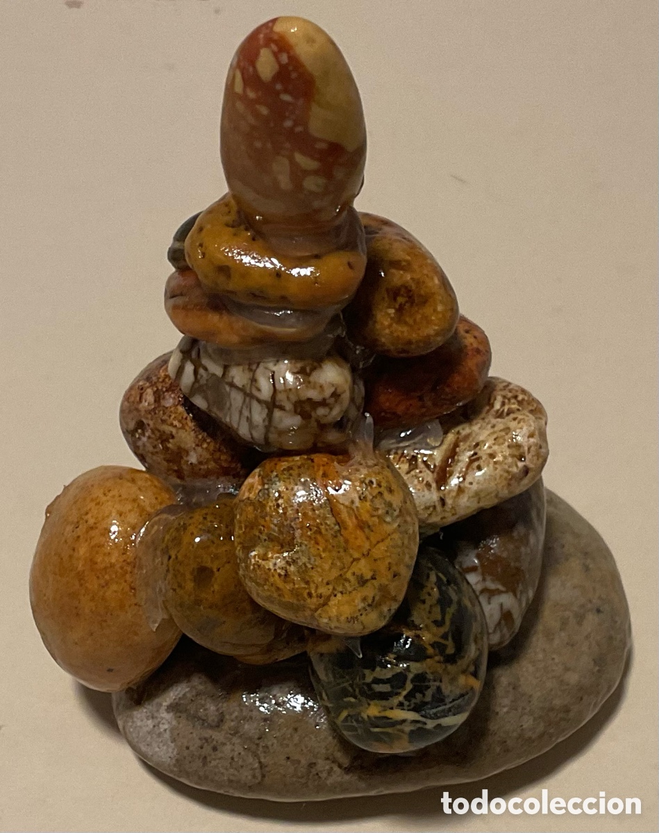 Art: N&uacute;mero 9. Escultura de piedra.