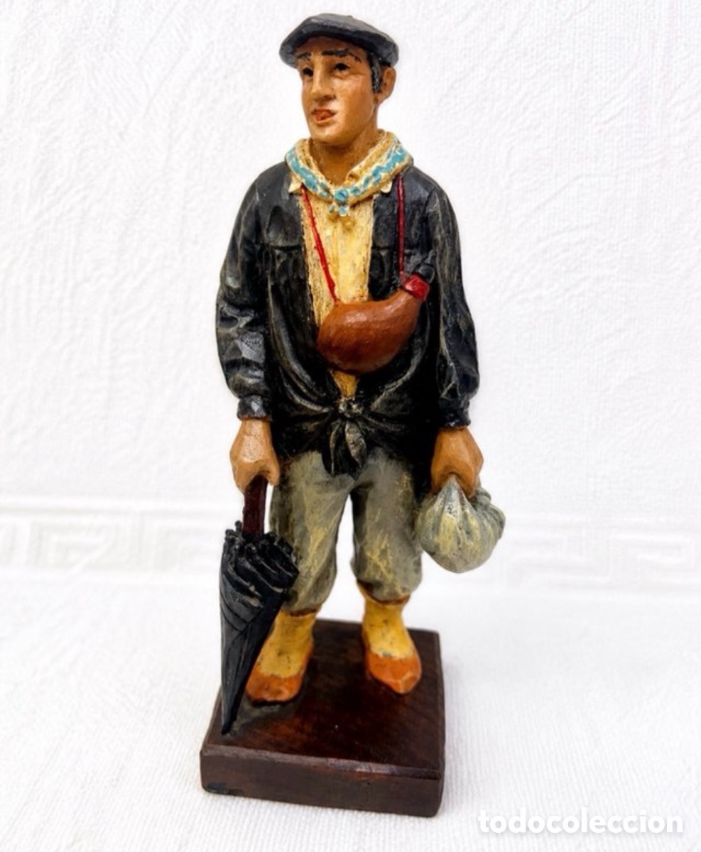 Arte: Campesino con paraguas, norte de Espa&ntilde;a