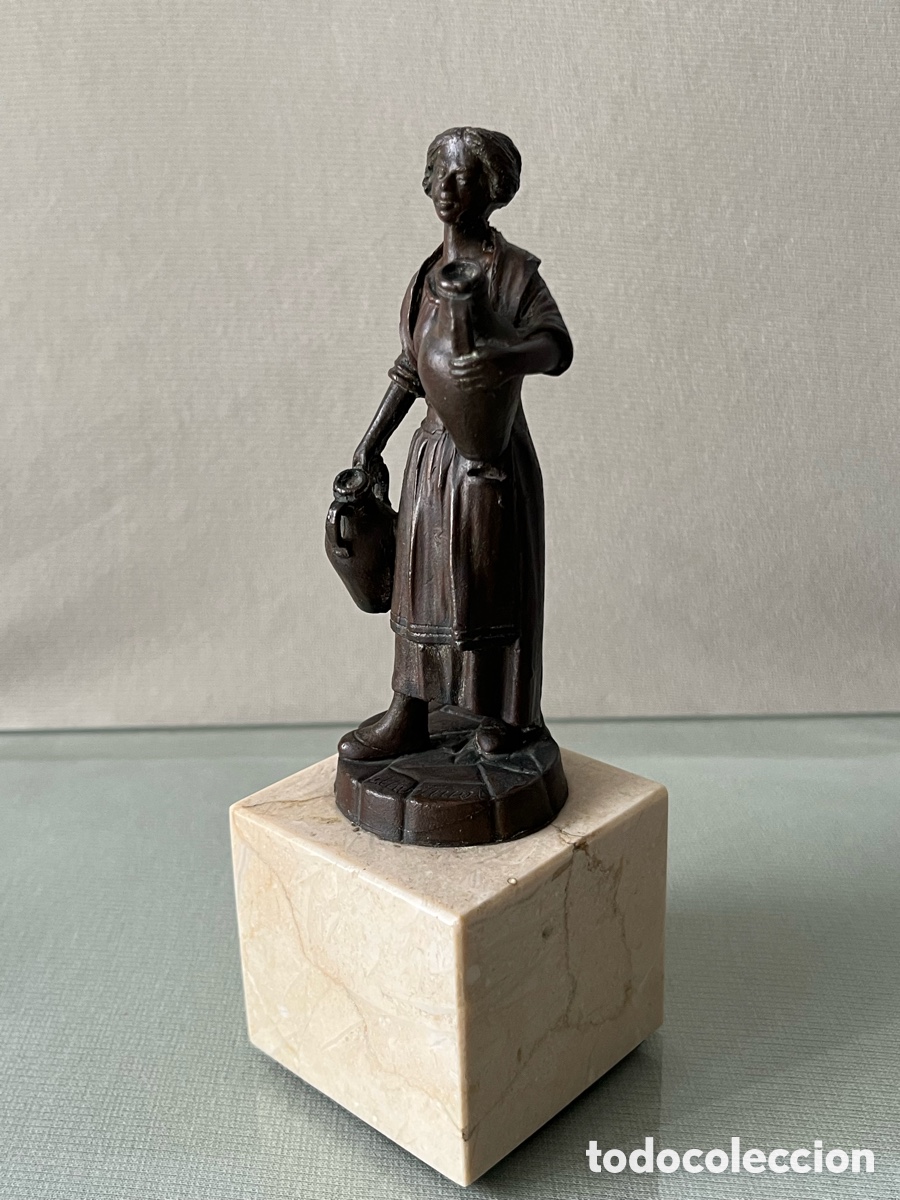 Arte: Escucha de bronce - Figura tradicional con c&aacute;ntaros