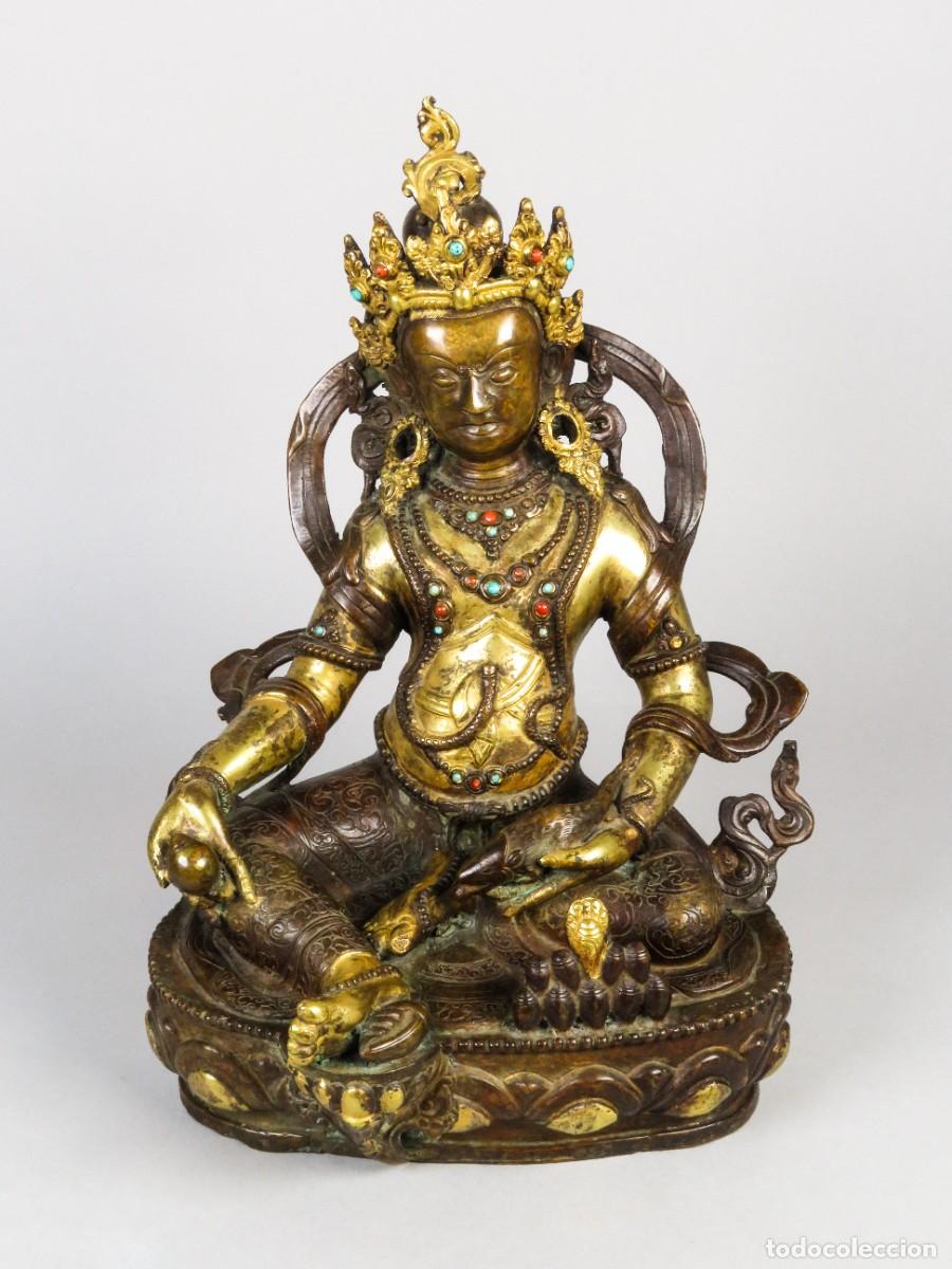 Arte: Escultura budista representando a Jambhala Amarillo en bronce dorado siglo XX