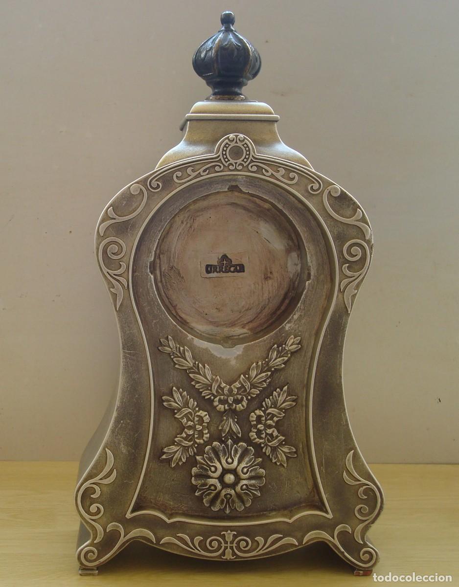 Arte: URREGUI : Bonito porta reloj de terracota con acabado en bronce